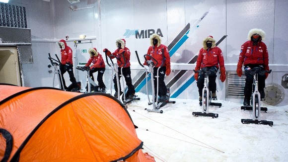 Prince Harry and the team practice skiing in the cold chamber.