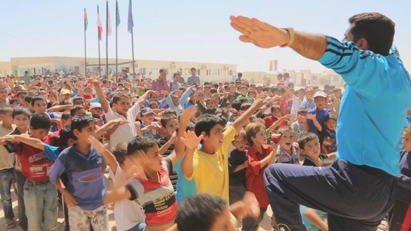 Children do exercises with an instructor at the camp