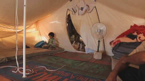 Inside Um Shadi Bardan's tent at Zaatari refugee camp