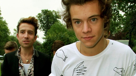 Harry Styles (right) and Nick Grimshaw arrive for the Fashion East Spring/Summer 2014 fashion