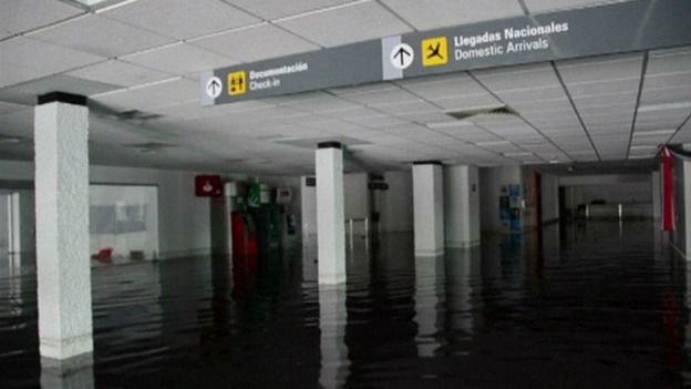 The airport buildings are flooded stranding tourists.