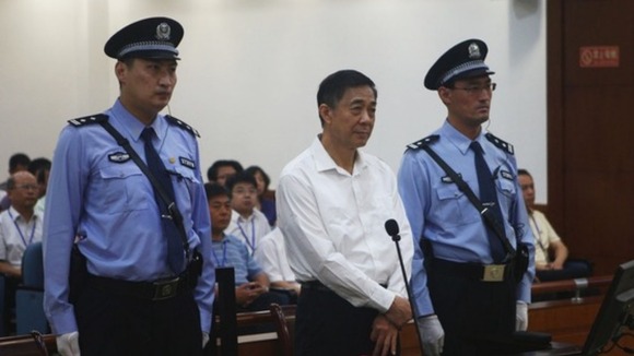 Disgraced Chinese politician Bo Xilai stands trial inside the court in Jinan, Shandong province.