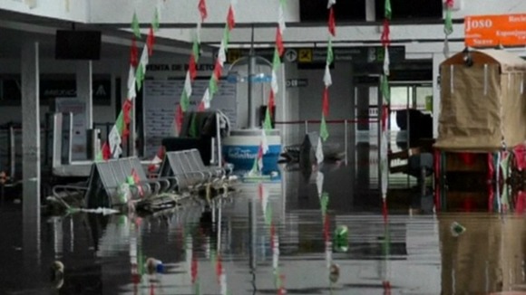 The departure lounge is flooded at Acapulco airport.