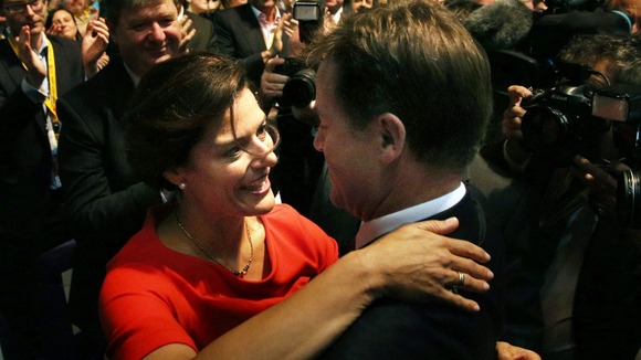 Clegg is greeted by his wife Miriam after delivering his keynote speech.