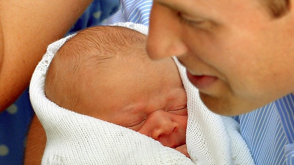 Prince George in the safe hands of the Duke of Cambridge