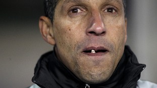 Chris Hughton watches his Birmingham team play football