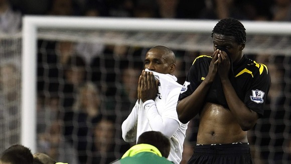 Players look on as paramedics race to save Fabrice Muamba's life.