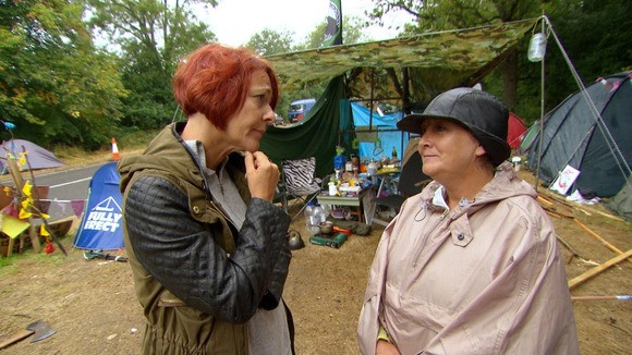 female reporter speaking to middle-aged female protestor