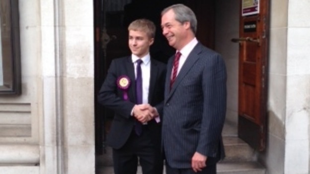 Ukip leader Nigel Farage (R) arrives at the annual conference in London