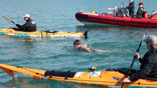 Swimmer Anna Wardley with support boats