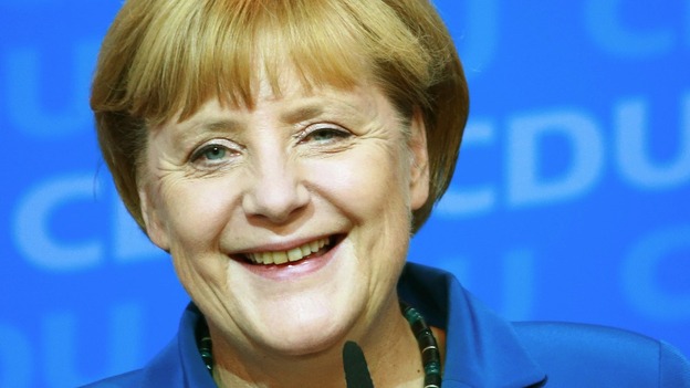 German Chancellor Angela Merkel reacts to first results of the 2013 German federal elections.