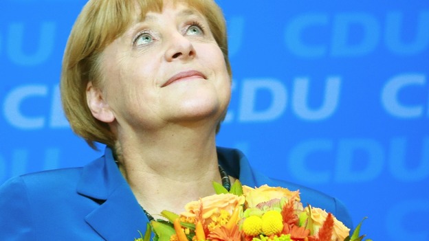 German Chancellor Angela Merkel reacts to first results of the 2013 German federal elections