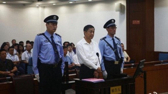 Disgraced Chinese politician Bo Xilai standing trial inside the court in Jinan, Shandong province.