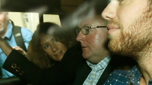 Damian McBride (centre) leaves the Labour party conference