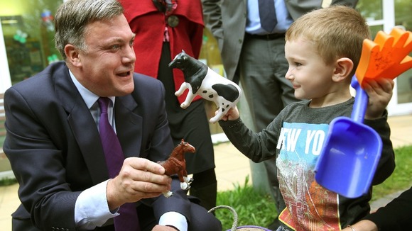 Shadow Chancellor Ed Balls plays with three year old Connor Felton at the Roundabout Children's Centre in Brighton