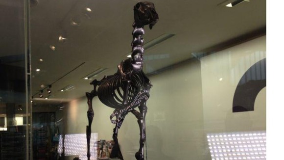 A skeleton with a London Stock Exchange ticker on its front leg