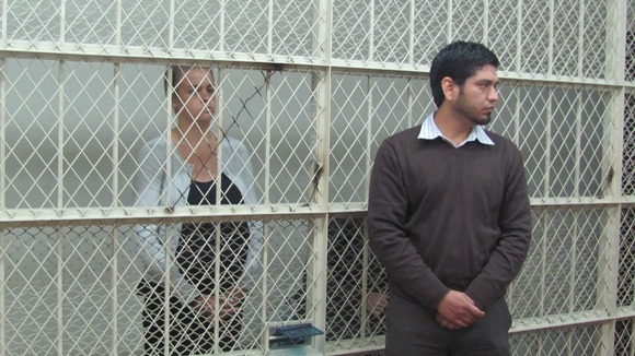 Melissa Reid and Michaela McCollum Connelly behind bars inside the court in Peru.