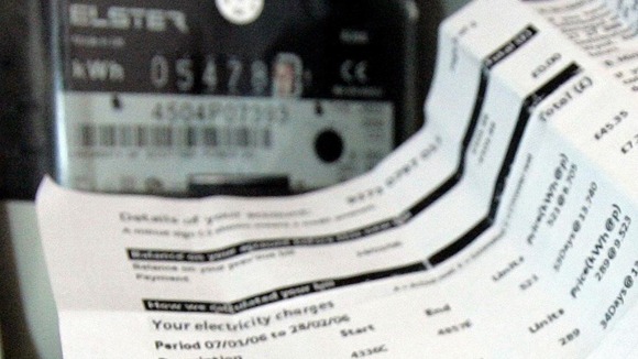 An energy bill next to an electricity meter.