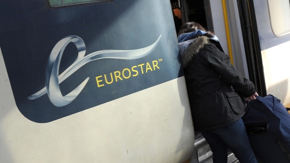 Passenger boarding a Eurostar train at St Pancras Station