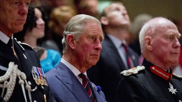 Charles with Met Police chief Sir Bernard Hogan-Howe (left) and Lord Lieutenant of South Glamorgan Dr Peter Beck (right).