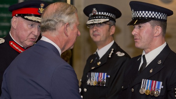 The Prince of Wales meets Sergeant Joe Holness (right), founder of National Police Memorial Day, during the National Police Memorial Day.