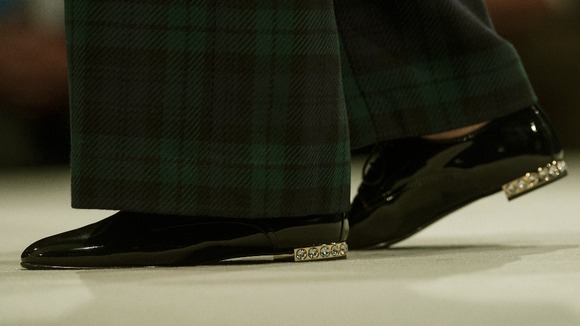 Theresa May was wearing these bejeweled heeled shoes for her conference speech yesterday.