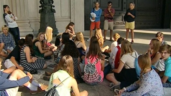 School children gather outside the National Archives which have been closed as a part of the US shutdown.