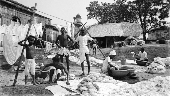 Waterside with group of washermen at a dhobi ghat