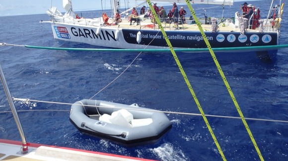 The team transports water from another yacht