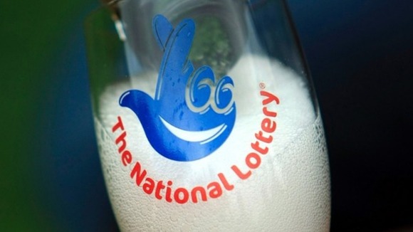 Champagne with National Lottery sign on it.