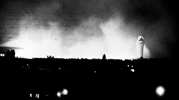 Taken ten miles away this image shows the one remaining tower of Crystal Palace still standing during the fire