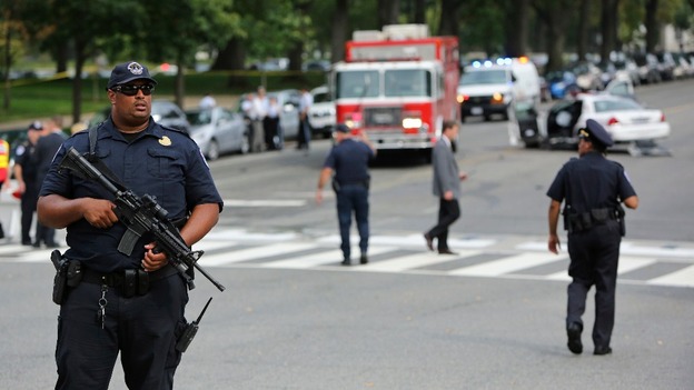 Police patrol the area after gunshots were fired outside the US Capitol building in Washington.
