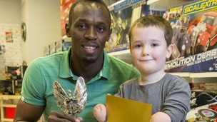 Six-times Olympic gold medallist Usain Bolt with Pride of Britain Award winner, Harley Lane.