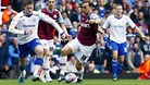 Cardiff City's Aron Gunnarsson and West Ham United's Mark Noble battle for the ball