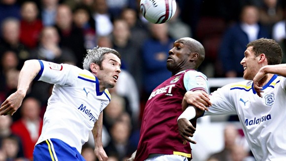 Cardiff City's Kevin McNaughton and West Ham United's Carlton Cole