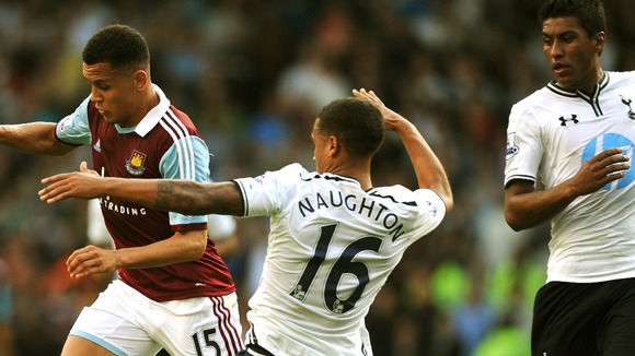 Kyle Naughton (right) and West Ham United's Ravel Morrison (left) seen during the game on Sunday