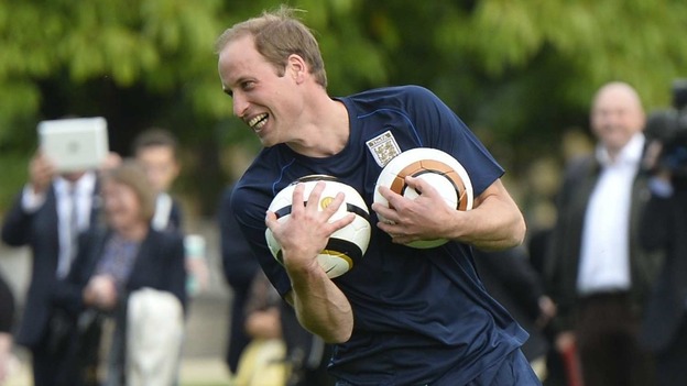 Duke of Cambridge trains with members of the Royal household during the second half of the match
