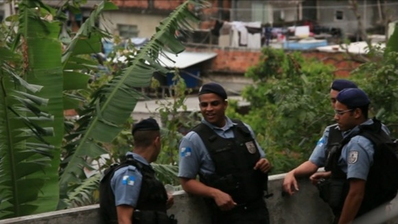 Brazil's police dawn raids attempt to tame the favelas.