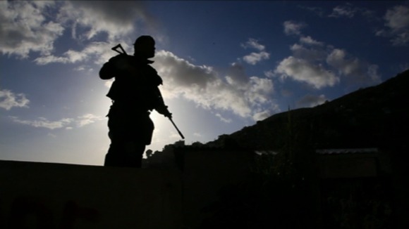 Brazil's police dawn raids attempt to tame the favelas.