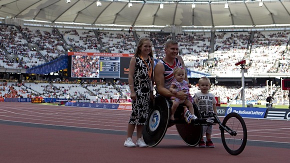 David Weir celebrates with his children Ronie, Tillia Grace and Mason at the Olympic Stadium in London