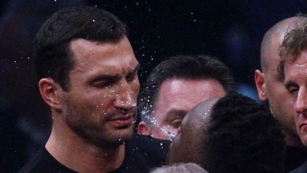 British boxer Dereck Chisora spits water in the face of Vladimir Klitschko.