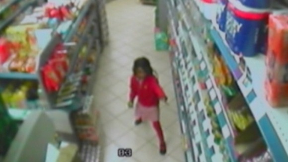 A CCTV image of Thusha dancing through the aisles of her uncle's grocery store before she was shot.