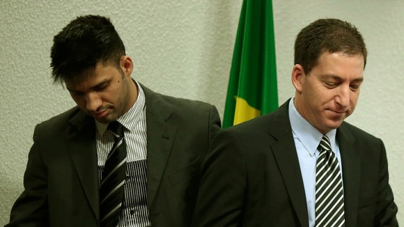 Glenn Greenwald (r) and his partner David Miranda as he testifies in front of the Brazilian Federal Senate.