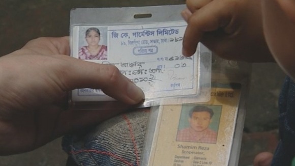 Bojol holds ID cards belonging to the parents he lost in the building collapse