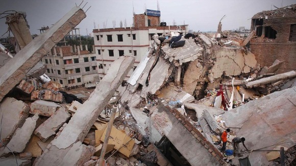 Men attempt to rescue the garment workers from the rubble of the collapsed Rana Plaza building