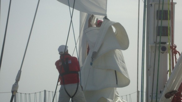 Battling to change a sail