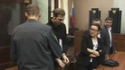 Kieron Bryan is led out of the dock in a Russian court in hand cuffs