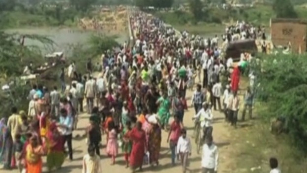 People by the river bank after the stampede.