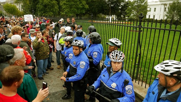Law enforcement officers clash with protesters from the 'Million Vet March on the Memorials'.