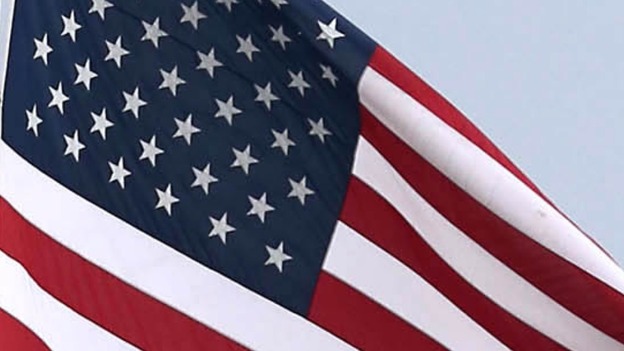 The stars and stripes flag moving in the wind.